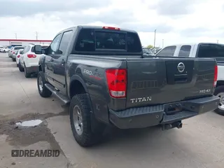 2011 Nissan Titan Pro-4X with VIN 1N6BA0EC3BN320795, listed as a IAAI auction lot 41868113 with 183,919 mi miles and . Bid and sale history available at DreamBid. Image 3.