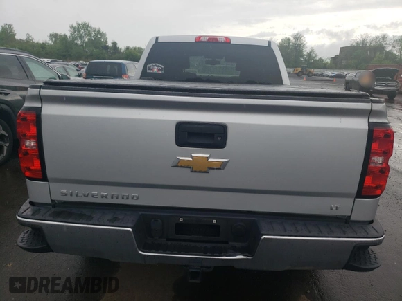 2018 Chevrolet Silverado 1500 LT with VIN 1GCVKREH8JZ102484, listed as a Copart auction lot 55114225 with 59,185 mi miles and Salvage Title. Bid and sale history available at DreamBid. Image 6.