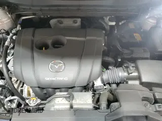 2025 Mazda CX-5 S Preferred z VIN JM3KFBCLXS0702166, wystawiony jako Copart lot #86679835 z przebiegiem 4 015 mil mil oraz Czysty tytuł • Clean title. Historia ofert i sprzedaży dostępna na DreamBid. Obrazek 14.