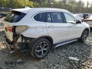 2017 BMW X1 xDrive28i with VIN WBXHT3C33H5F70208, listed as a Copart auction lot 67999764 with 130,341 mi miles and Salvage Title. Bid and sale history available at carsss.com. Image 3.