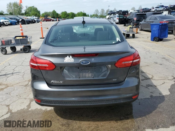 2018 Ford Focus SE z VIN 1FADP3F24JL204488, wystawiony jako Copart lot #54733625 z przebiegiem Nie podano mil oraz Szkoda całkowita • Salvage title. Historia ofert i sprzedaży dostępna na DreamBid. Obrazek 6.