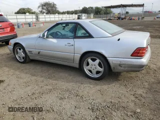 1999 Mercedes-Benz SL-Class with VIN WDBFA68F4XF184335, listed as a Copart auction lot 86287834 with 97,564 mi miles and Salvage Title. Bid and sale history available at carsss.com. Image 2.