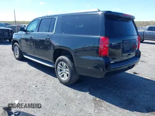 2015 Chevrolet Suburban LT z VIN 1GNSKJKC2FR162921, wystawiony jako IAAI lot #41961114 z przebiegiem 296 918 mil mil oraz . Historia ofert i sprzedaży dostępna na DreamBid. Obrazek 3.
