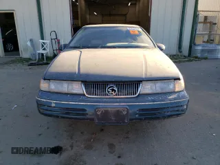 1992 Mercury Cougar z VIN 1MEPM6046NH628614, wystawiony jako Copart lot #77434664 z przebiegiem 83 518 mil mil oraz Szkody całkowita. Historia ofert i sprzedaży dostępna na DreamBid. Obrazek 5.