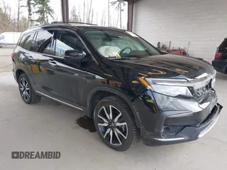 2021 Honda Pilot Elite with VIN 5FNYF6H04MB043014, listed as a IAAI auction lot 41826931 with 63,546 mi miles and . Bid and sale history available at DreamBid. Image 1.