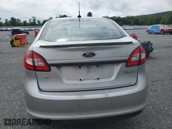 2013 Ford Fiesta SE z VIN 3FADP4BJ9DM108667, wystawiony jako Copart lot #58542295 z przebiegiem 94 812 mil mil oraz Szkoda całkowita • Salvage title. Historia ofert i sprzedaży dostępna na DreamBid. Obrazek 6.
