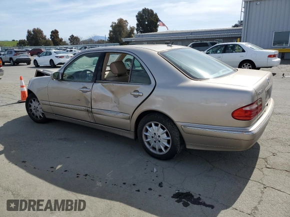 2001 Mercedes-Benz E-Class with VIN WDBJF65J11B357893, listed as a Copart auction lot 48573305 with 141,044 mi miles and Salvage Title. Bid and sale history available at carsss.com. Image 2.