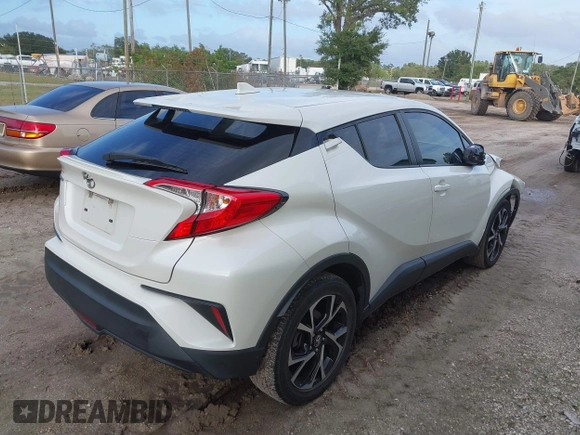 2018 Toyota C-HR XLE with VIN JTNKHMBX3J1010211, listed as a IAAI auction lot 40799443 with 104,148 mi miles. Bid and sale history available at carsss.com. Image 4.