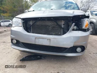 2017 Dodge Grand Caravan SXT with VIN 2C4RDGCG6HR671199, listed as a IAAI auction lot 42031157 with 99,189 mi miles and . Bid and sale history available at DreamBid. Image 20.