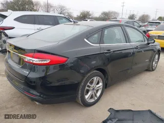 2018 Ford Fusion Hybrid S with VIN 3FA6P0UU9JR100852, listed as a IAAI auction lot 41516157 with 63,458 mi miles. Bid and sale history available at carsss.com. Image 4.