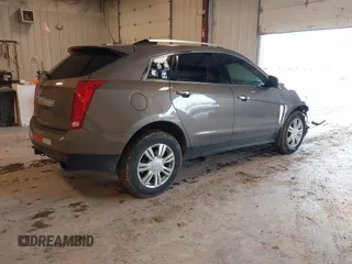2015 Cadillac SRX Luxury Collection with VIN 3GYFNBE34FS575613, listed as a IAAI auction lot 41697251 with 173,117 mi miles and . Bid and sale history available at DreamBid. Image 4.