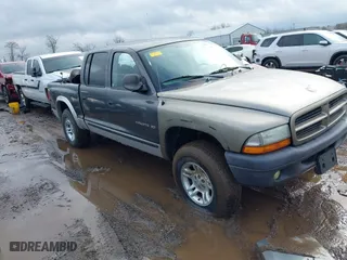 2002 Dodge Dakota SLT with VIN 1B7HG48N32S634478, listed as a IAAI auction lot 41485500 with 166,082 mi miles. Bid and sale history available at carsss.com. Image 1.