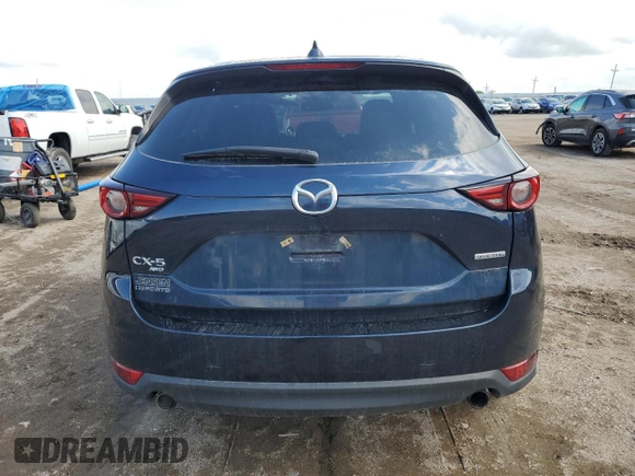 2021 Mazda CX-5 Grand Touring with VIN JM3KFBDM0M0500561, listed as a Copart auction lot 58214665 with 49,543 mi miles and Salvage title. Bid and sale history available at DreamBid. Image 6.