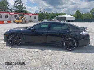 2016 Porsche Panamera 4 z VIN WP0AA2A71GL001210, wystawiony jako IAAI lot #42230574 z przebiegiem Nie podano mil oraz . Historia ofert i sprzedaży dostępna na DreamBid. Obrazek 14.
