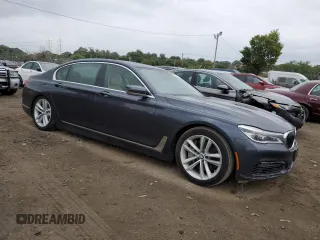 2016 BMW 7 Series 750i with VIN WBA7F0C54GGL99661, listed as a Copart auction lot 71742154 with 104,498 mi miles and Salvage Title. Bid and sale history available at carsss.com. Image 4.