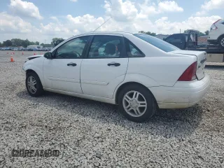 2003 Ford Focus SE with VIN 1FAFP34353W231334, listed as a Copart auction lot 63844205 with 86,601 mi miles and Salvage title. Bid and sale history available at DreamBid. Image 2.