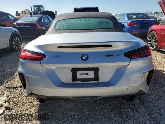 2022 BMW Z4 sDrive30i with VIN WBAHF3C03NWX80169, listed as a Copart auction lot 74791084 with 0 mi miles and Salvage Title. Bid and sale history available at carsss.com. Image 6.