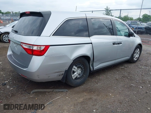 2011 Honda Odyssey LX with VIN 5FNRL5H25BB040287, listed as a IAAI auction lot 42456679 with 129,176 mi miles and . Bid and sale history available at DreamBid. Image 4.