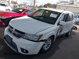 2014 Dodge Journey SXT with VIN 3C4PDCBGXET122969, listed as a IAAI auction lot 41741679 with 151,285 mi miles. Bid and sale history available at carsss.com. Image 2.