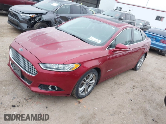 2016 Ford Fusion Titanium Hybrid with VIN 3FA6P0RU3GR355398, listed as a IAAI auction lot 41140669 with 125,959 mi miles. Bid and sale history available at carsss.com. Image 2.