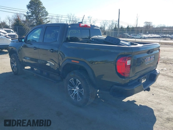2023 GMC Canyon 4WD AT4 with VIN 1GTP6DEK1P1174713, listed as a IAAI auction lot 41733242 with 35,705 mi miles. Bid and sale history available at carsss.com. Image 3.