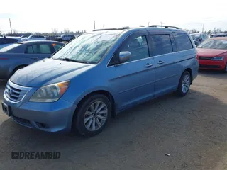 2008 Honda Odyssey Touring with VIN 5FNRL38868B047556, listed as a IAAI auction lot 41581617 with 220,436 mi miles. Bid and sale history available at carsss.com. Image 2.