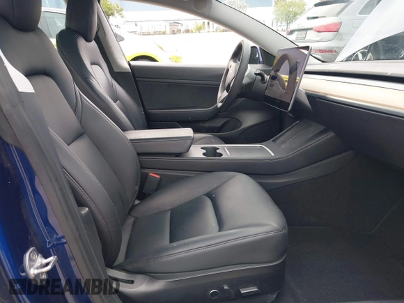 2021 Tesla Model 3 Long Range with VIN 5YJ3E1EB6MF878411, listed as a IAAI auction lot 41986947 with 71,978 mi miles and . Bid and sale history available at DreamBid. Image 5.
