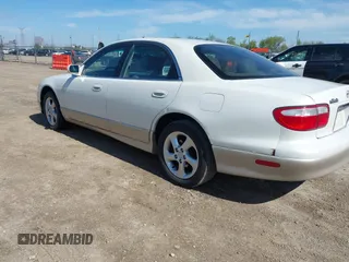 2001 Mazda Millenia z VIN JM1TA221111714677, wystawiony jako IAAI lot #42203182 z przebiegiem 130 847 mil mil oraz . Historia ofert i sprzedaży dostępna na DreamBid. Obrazek 3.