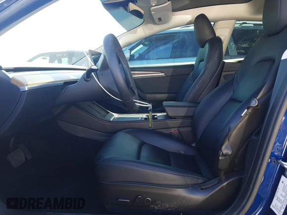 2023 Tesla Model 3 with VIN 5YJ3E1EA5PF652212, listed as a Copart auction lot 57348395 with 8,780 mi miles and Salvage title. Bid and sale history available at DreamBid. Image 7.