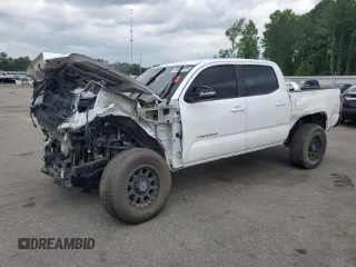 2018 Toyota Tacoma SR with VIN 3TMCZ5AN1JM172837, listed as a Copart auction lot 56003055 with 106,689 mi miles and Salvage title. Bid and sale history available at DreamBid. Image 1.
