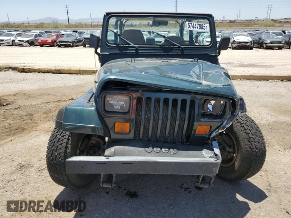 1994 Jeep Wrangler S with VIN 1J4FY19P7RP437520, listed as a Copart auction lot 57447085 with 124,023 mi miles and Salvage title. Bid and sale history available at DreamBid. Image 5.