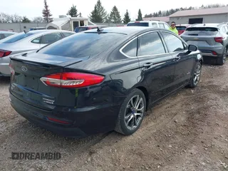 2019 Ford Fusion Hybrid Titanium with VIN 3FA6P0RU4KR144445, listed as a IAAI auction lot 42059840 with 90,617 mi miles. Bid and sale history available at carsss.com. Image 4.