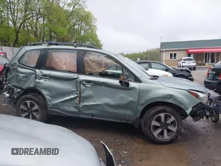 2017 Subaru Forester z VIN JF2SJABC4HH452602, wystawiony jako IAAI lot #42197639 z przebiegiem 141 385 mil mil oraz . Historia ofert i sprzedaży dostępna na DreamBid. Obrazek 14.