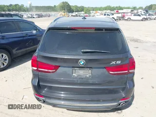 2014 BMW X5 xDrive35d with VIN 5UXKS4C57E0J93982, listed as a IAAI auction lot 42085173 with 169,908 mi miles. Bid and sale history available at carsss.com. Image 22.
