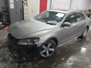 2013 Volkswagen Passat SE w/Sunroof & Nav with VIN 1VWBP7A30DC150018, listed as a IAAI auction lot 41580416 with 75,231 mi miles. Bid and sale history available at carsss.com. Image 2.