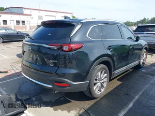 2021 Mazda CX-9 Carbon Edition with VIN JM3TCBDY3M0524241, listed as a IAAI auction lot 42538127 with 50,533 mi miles and . Bid and sale history available at DreamBid. Image 4.