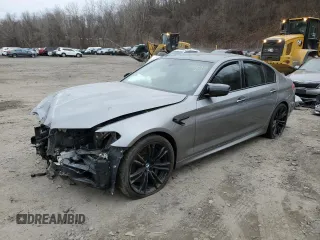 2018 BMW M5 z VIN WBSJF0C51JB283579, wystawiony jako Copart lot #84823844 z przebiegiem Nie podano mil oraz Szkody całkowita. Historia ofert i sprzedaży dostępna na DreamBid. Obrazek 1.