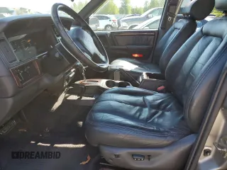 1998 Jeep Grand Cherokee Limited z VIN 1J4GZ88Z1WC231772, wystawiony jako Copart lot #55697775 z przebiegiem 178 896 mil mil oraz Czysty tytuł • Clean title. Historia ofert i sprzedaży dostępna na DreamBid. Obrazek 7.
