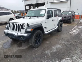 2021 Jeep Wrangler Unlimited Sport Altitude with VIN 1C4HJXDG2MW791599, listed as a IAAI auction lot 41235427 with 47,220 mi miles and . Bid and sale history available at DreamBid. Image 18.