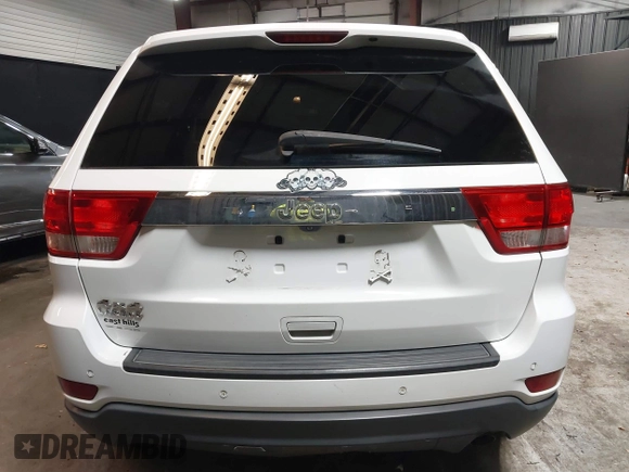 2013 Jeep Grand Cherokee Laredo with VIN 1C4RJFAG9DC532919, listed as a IAAI auction lot 40918828 with 140,093 mi miles. Bid and sale history available at carsss.com. Image 16.