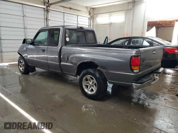 2000 Mazda B-Series 2WD Truck SE with VIN 4F4YR16V8YTM12086, listed as a Copart auction lot 82609244 with 297,354 mi miles and Salvage Title. Bid and sale history available at carsss.com. Image 2.