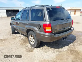 1999 Jeep Grand Cherokee Limited with VIN 1J4GW68N5XC773100, listed as a IAAI auction lot 41998432 with Not provided miles and . Bid and sale history available at DreamBid. Image 3.