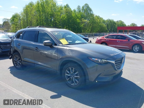 2021 Mazda CX-9 Touring with VIN JM3TCACY7M0503484, listed as a IAAI auction lot 42013262 with 63,777 mi miles and . Bid and sale history available at DreamBid. Image 1.
