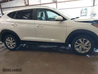 2019 Hyundai Tucson Value with VIN KM8J33A46KU066106, listed as a IAAI auction lot 41397738 with 41,717 mi miles. Bid and sale history available at carsss.com. Image 14.