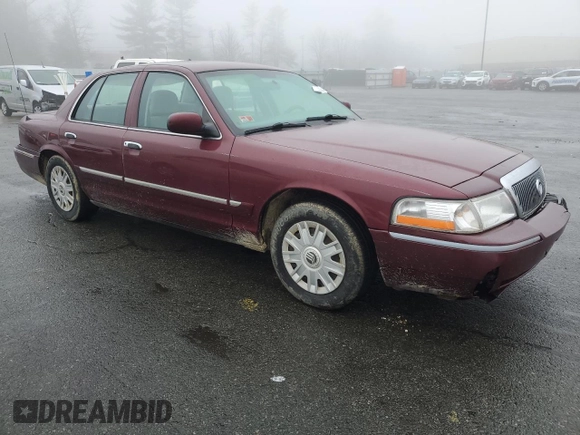 2005 Mercury Grand Marquis GS with VIN 2MEFM74W05X604628, listed as a Copart auction lot 51332335 with 165,224 mi miles and Salvage Title. Bid and sale history available at DreamBid. Image 4.
