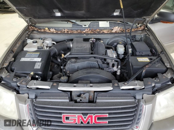 2003 GMC Envoy SLE z VIN 1GKDT13S432136642, wystawiony jako Copart lot #53467095 z przebiegiem 98 832 mil mil oraz Szkoda całkowita • Salvage title. Historia ofert i sprzedaży dostępna na DreamBid. Obrazek 12.