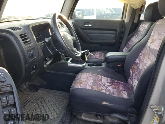 2009 Hummer H3 with VIN 5GNEN13E698128049, listed as a Copart auction lot 70453514 with 154,567 mi miles and Salvage Title. Bid and sale history available at DreamBid. Image 7.