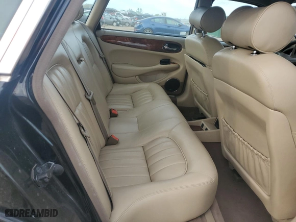 2000 Jaguar XJ with VIN SAJDA14C7YLF11390, listed as a Copart auction lot 73054184 with 0 mi miles and Salvage Title. Bid and sale history available at carsss.com. Image 10.