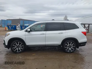 2021 Honda Pilot Elite with VIN 5FNYF6H03MB044154, listed as a IAAI auction lot 41050202 with 60,331 mi miles and . Bid and sale history available at DreamBid. Image 14.