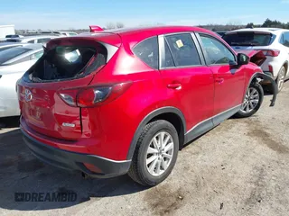 2014 Mazda CX-5 Touring z VIN JM3KE2CY2E0364488, wystawiony jako IAAI lot #41635188 z przebiegiem 127 688 mil mil oraz . Historia ofert i sprzedaży dostępna na DreamBid. Obrazek 4.